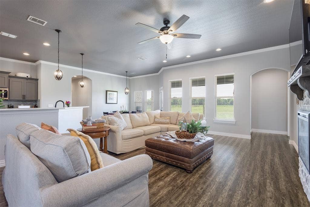 1538 Fm 36 N, Farmersville, TX 75442 Large windows open to the lush backyard and acreage. Open concept allows for all to gather in one area.