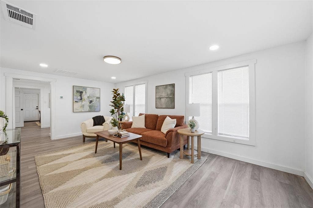 1116 Houston Street, Waco, TX 76704 Living room with light wood-style flooring and recessed lighting