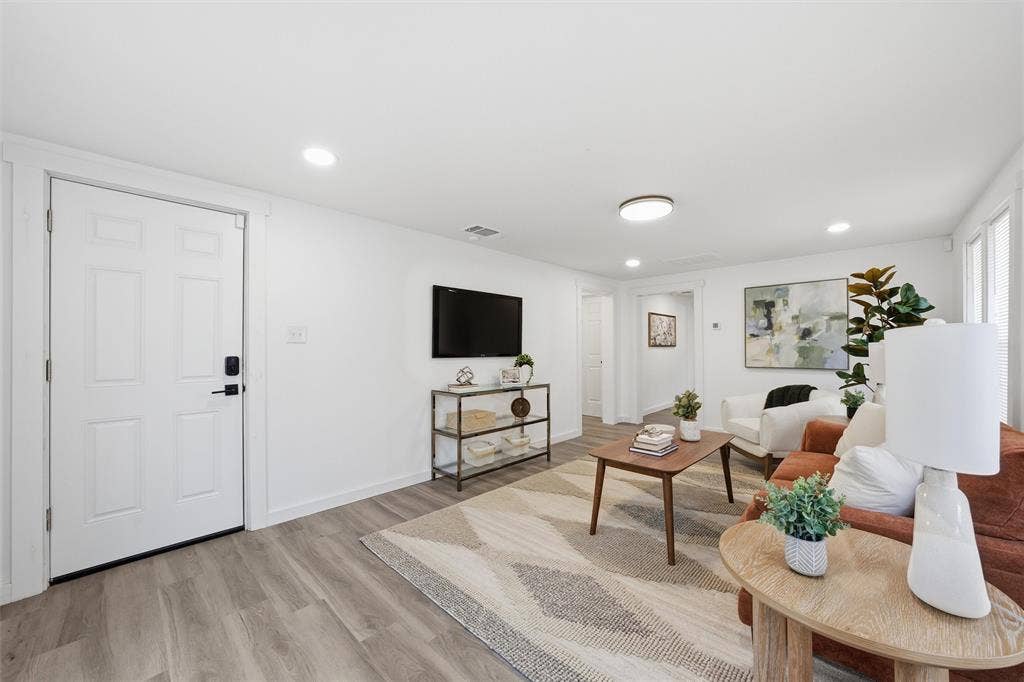 1116 Houston Street, Waco, TX 76704 Living area with light wood finished floors and recessed lighting