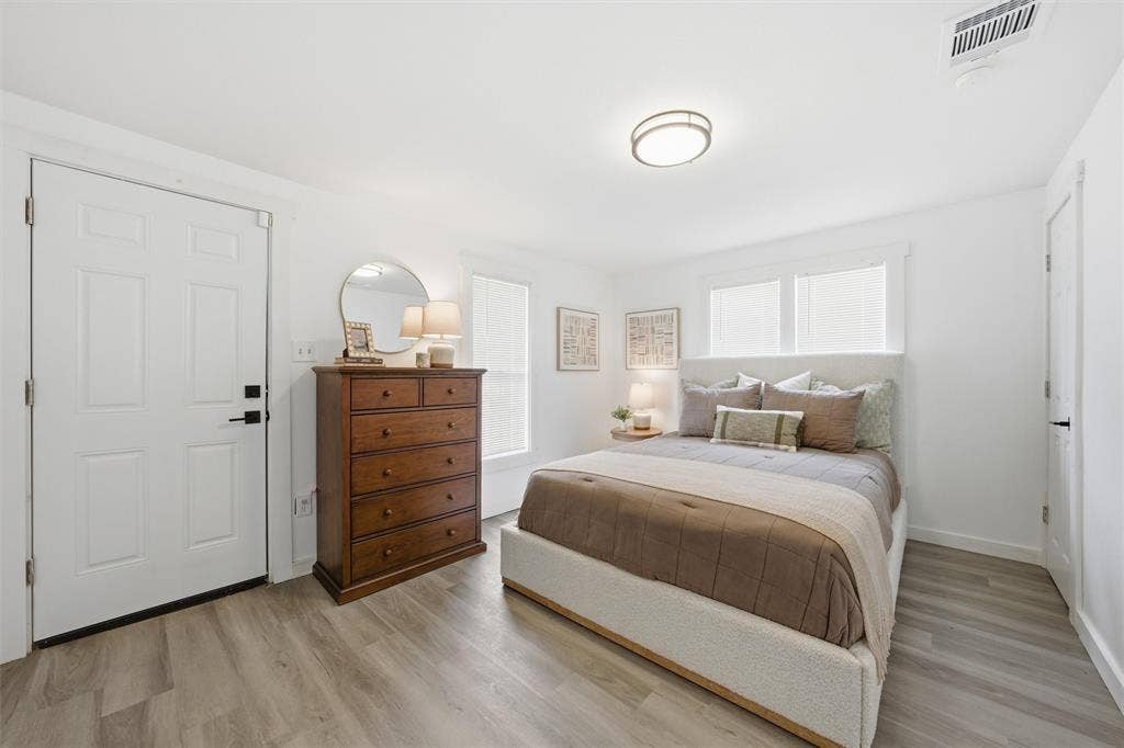 1116 Houston Street, Waco, TX 76704 Bedroom with light wood-style floors