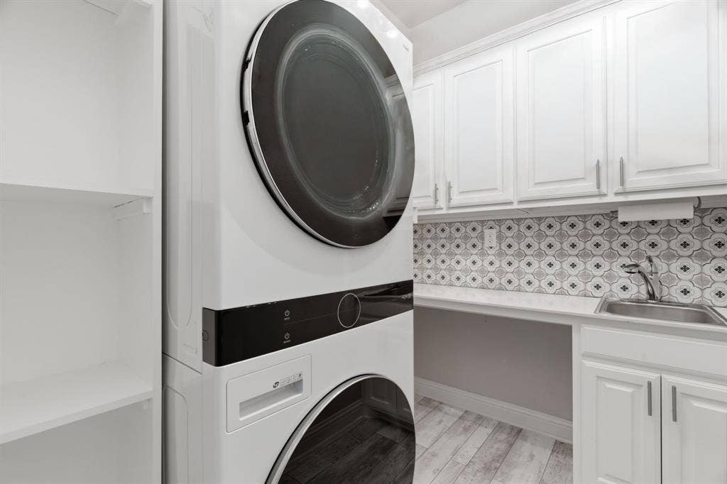1104 9th Street, Argyle, TX 76226 Laundry with built in cabinets. Washer and Dryer to convey!