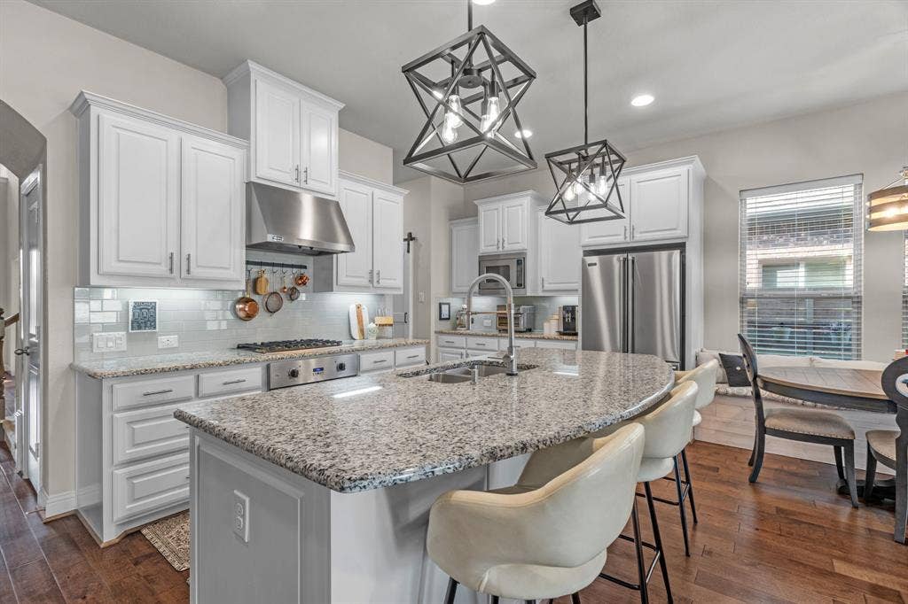 1104 9th Street, Argyle, TX 76226 Light and open kitchen equipped with luxury Viking appliances.