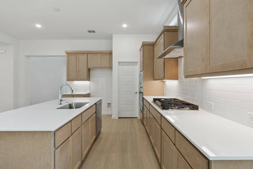 Kitchen in the Monet II home plan by Trophy Signature Homes – REPRESENTATIVE PHOTO