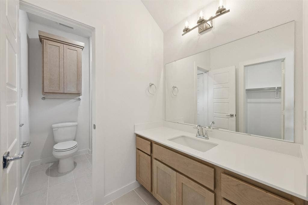 Bathroom in the Monet II home plan by Trophy Signature Homes – REPRESENTATIVE PHOTO