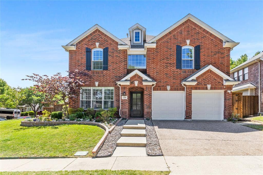 5201 Geode Lane, McKinney, TX 75072 This home sits on a beautiful corner lot with stunning landscaping all around. Everything is in bloom now then what picture is showing.