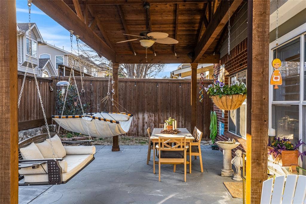5201 Geode Lane, McKinney, TX 75072 Beautiful covered porch that owners extended. The swing, hammoch and furniture on porch stay.