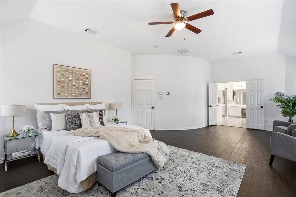 5201 Geode Lane, McKinney, TX 75072 The primary bedroom is exceptionally large with a beautiful curved accent wall. Gives it a metropolitan vibe.