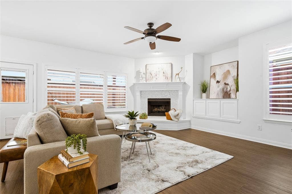 5201 Geode Lane, McKinney, TX 75072 Family room has lots of natural light with plantation shutters, cozy gas fireplace, entertainment nook with built in cabintry for entertainment equipment.