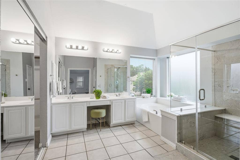 5201 Geode Lane, McKinney, TX 75072 Primary bathroom has a nice size garden tub surrounded by windows for natural light. Great for relaxing after a long day.