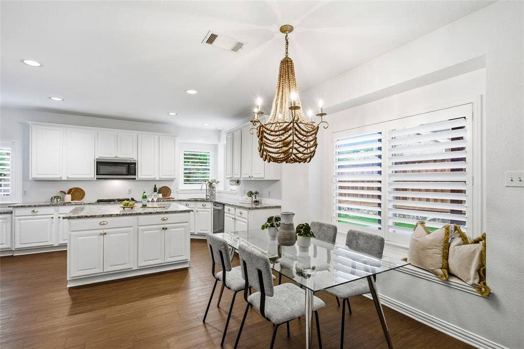 5201 Geode Lane, McKinney, TX 75072 Sunny kitchen nook with window seat and beautiful beaded chandelier.