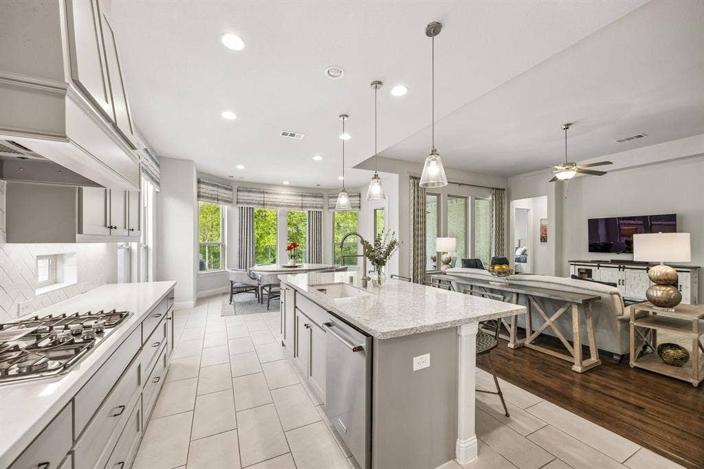 Bright, expansive open-concept kitchen and living area designed for seamless entertaining and modern daily living.