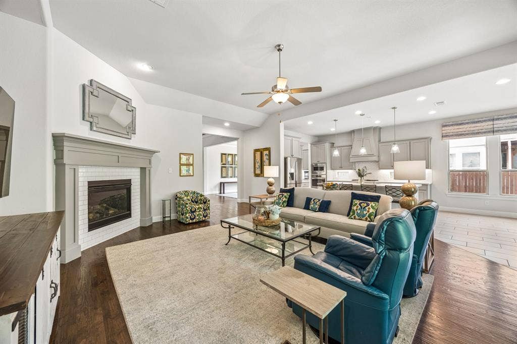 Impressive viewpoint showcases the ultimate open-concept layout, where the family room, breakfast area and kitchen blend into one expansive great room.