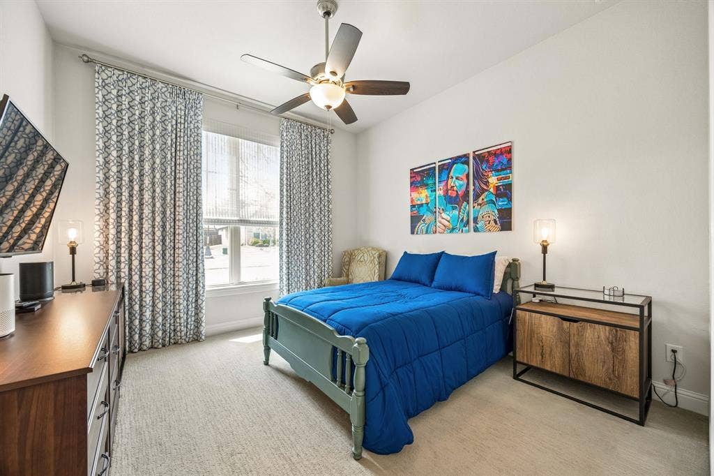 First floor split guest bedroom at the front of the home offers plenty of privacy for your guests.