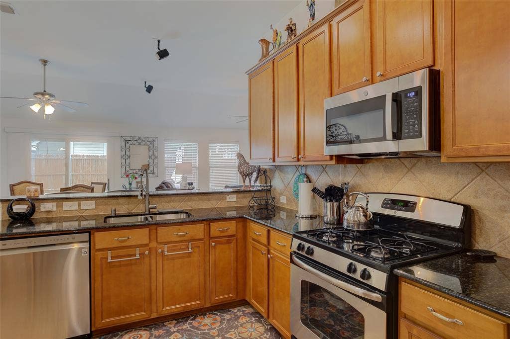 1913 Hidden Fairway Drive, Wylie, TX 75098 Open Kitchen with access and views of Living Room and Backyard