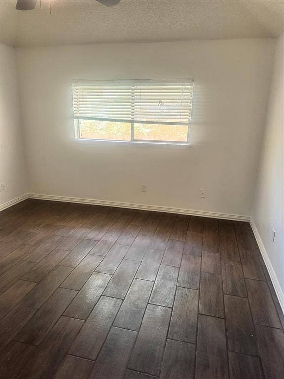2301 Holly Drive, Euless, TX 76039 Room featuring dark wood-finish flooring and white baseboards