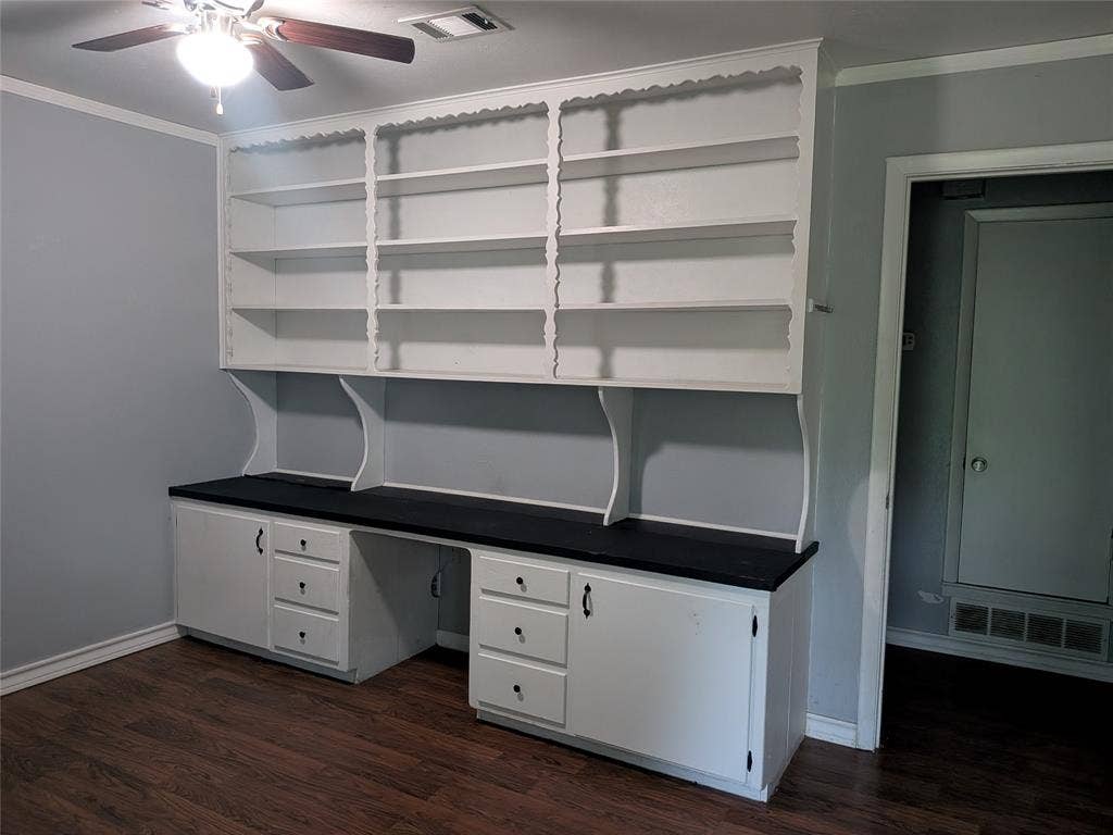 2009 County Road 4619, Athens, TX 75752 Unfurnished office featuring ornamental molding, dark wood-style flooring, a ceiling fan, and built in study area