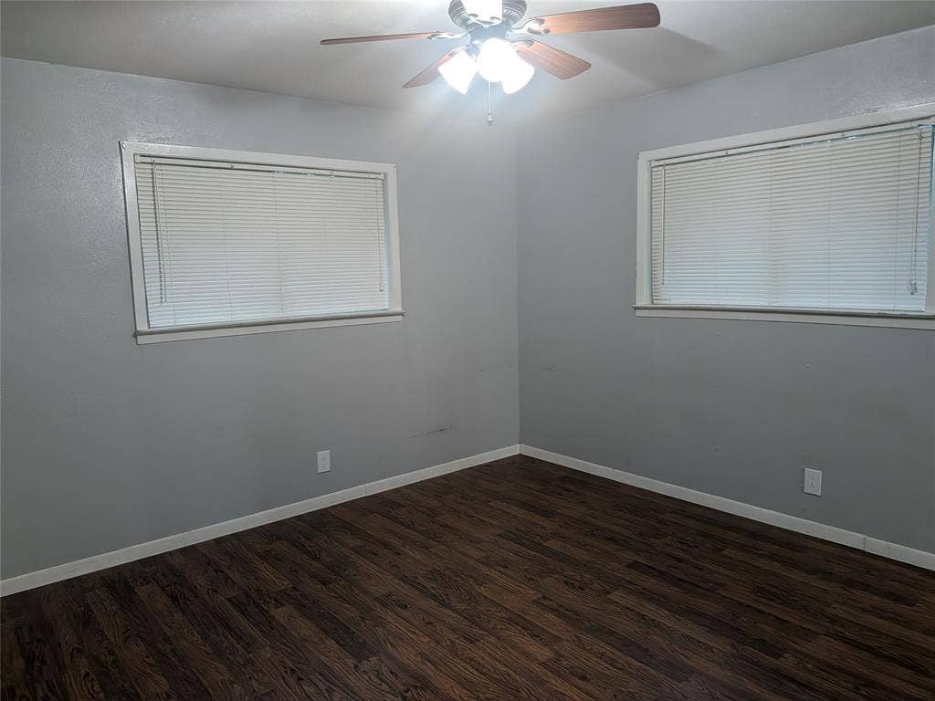 2009 County Road 4619, Athens, TX 75752 Unfurnished room featuring ceiling fan and dark wood-style flooring
