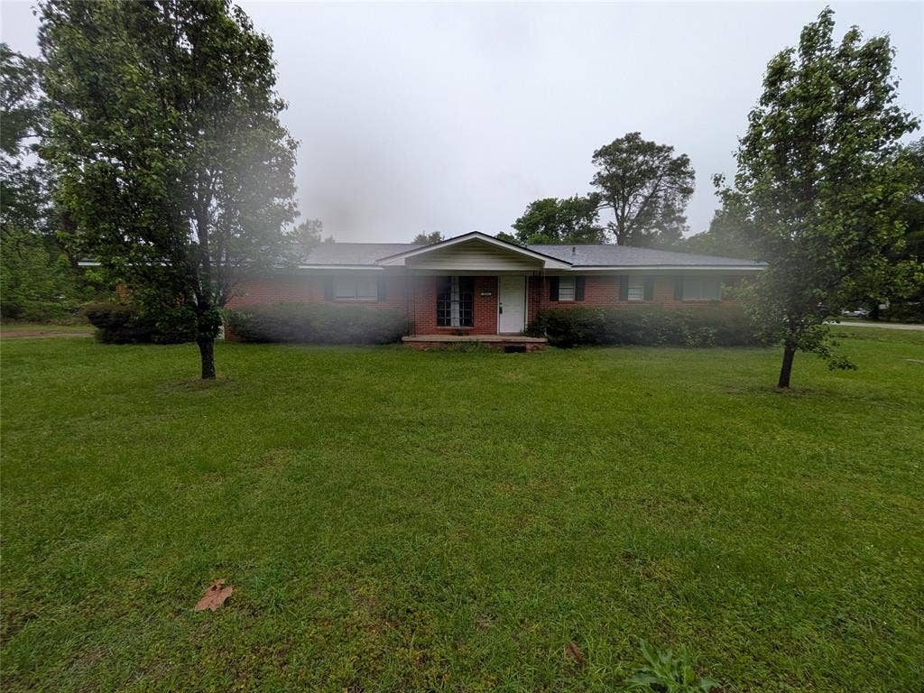 2009 County Road 4619, Athens, TX 75752 Single story home with a front yard and a porch