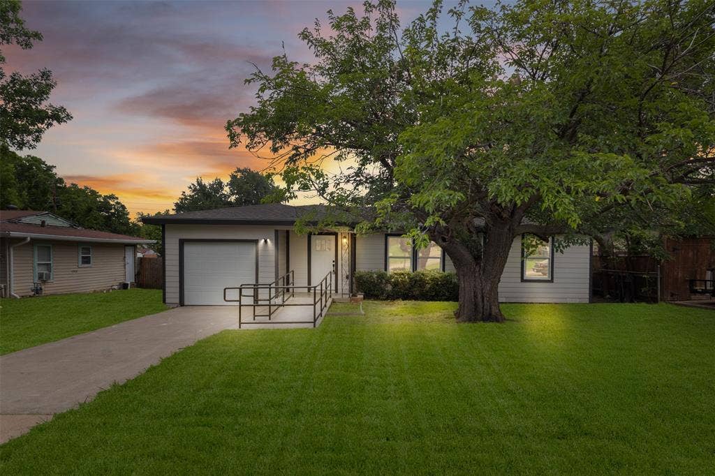425 Browning Drive, Arlington, TX 76010 Single-story residence featuring light-colored siding and a dark roofline