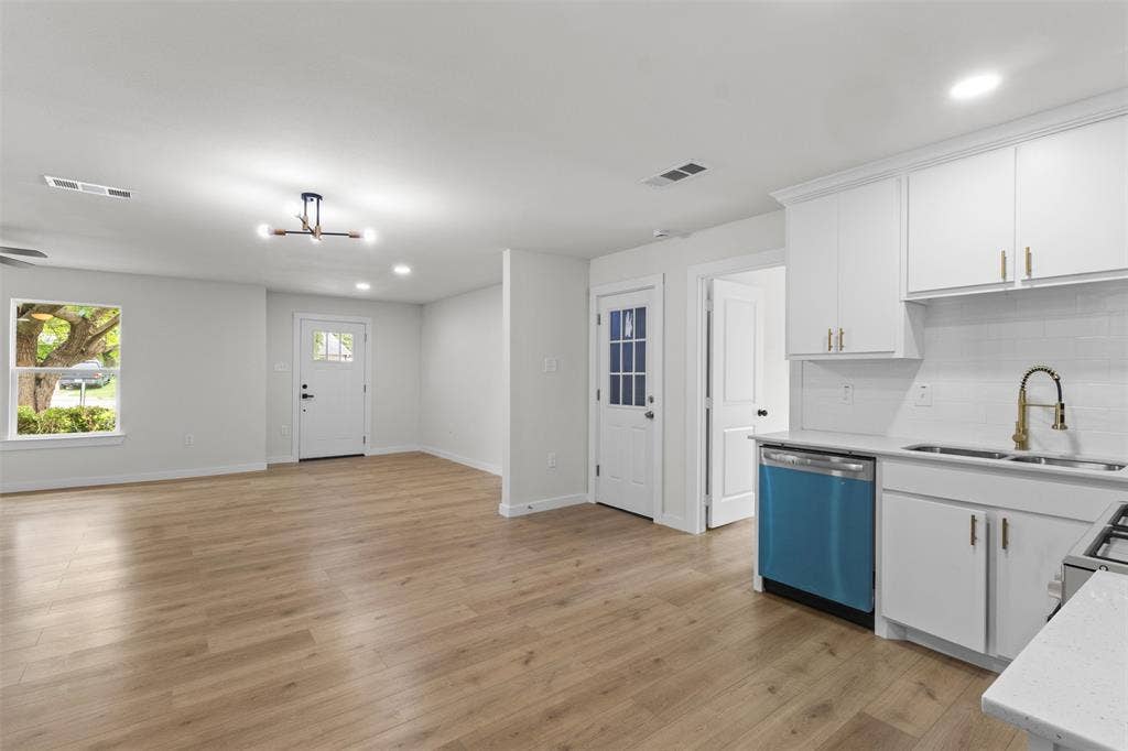 425 Browning Drive, Arlington, TX 76010 Open-concept living space featuring wood-finish flooring, recessed lighting, and a contemporary ceiling fixture