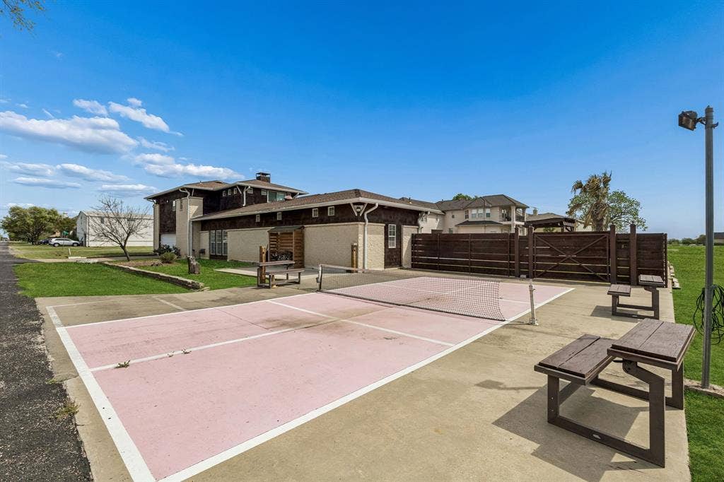 6360 Curtis Street, Plano, TX 75093 Pickle ball court on the west side of the corner lot. Three small custom built picnic stands are movable.