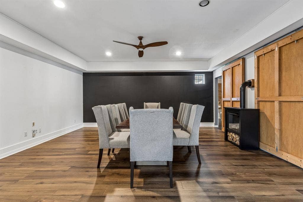 6360 Curtis Street, Plano, TX 75093 Large dining room with custom wood table made for the room! Decorative electric fireplace with remote. Two large barn doors.