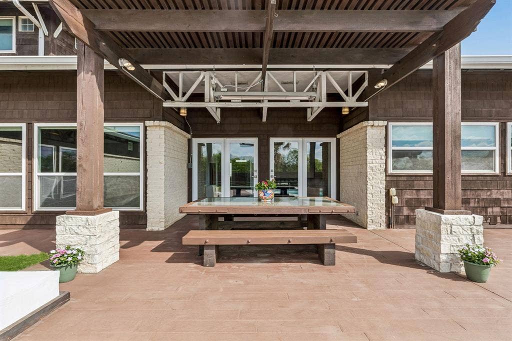 6360 Curtis Street, Plano, TX 75093 Custom built in heavy wood picnic table with glass inlay top. Solid covered pergola.