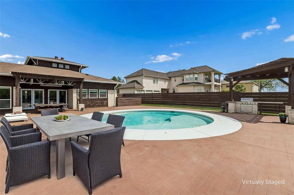 6360 Curtis Street, Plano, TX 75093 Extensive patio pool area with built in bar, grill and pergola.