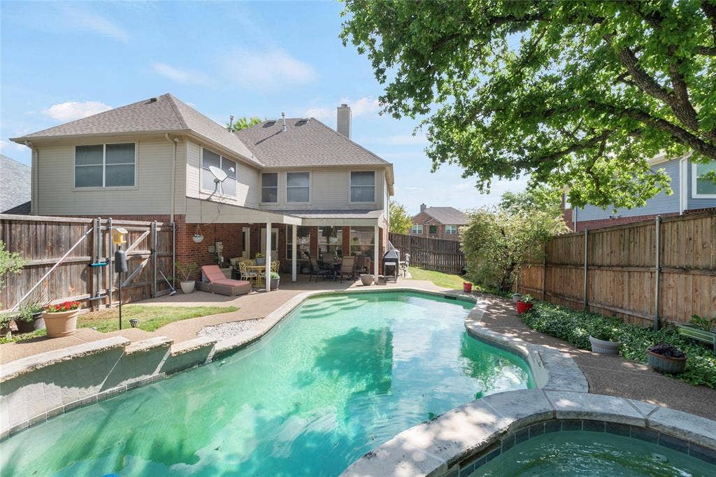 1608 Mountain Laurel Drive, Keller, TX 76248 View of swimming pool featuring patio surround, a fenced backyard, an in-ground hot tub, and a gate