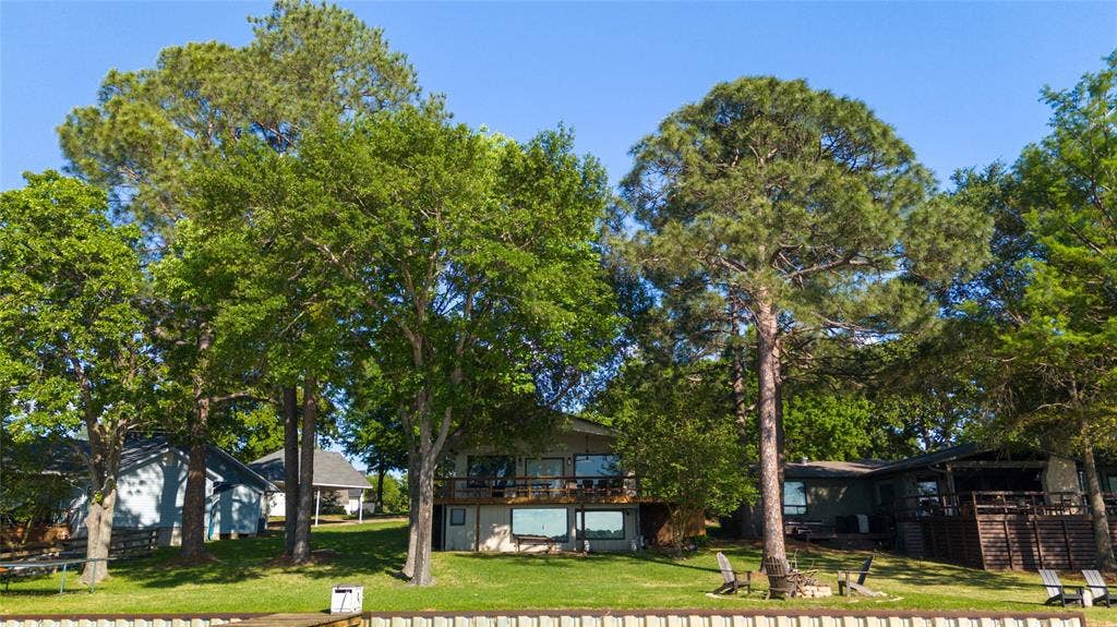 124 Shoreline Circle, Malakoff, TX 75148 Look at this wide lot with mature trees, well established lawns and ample elbow room!