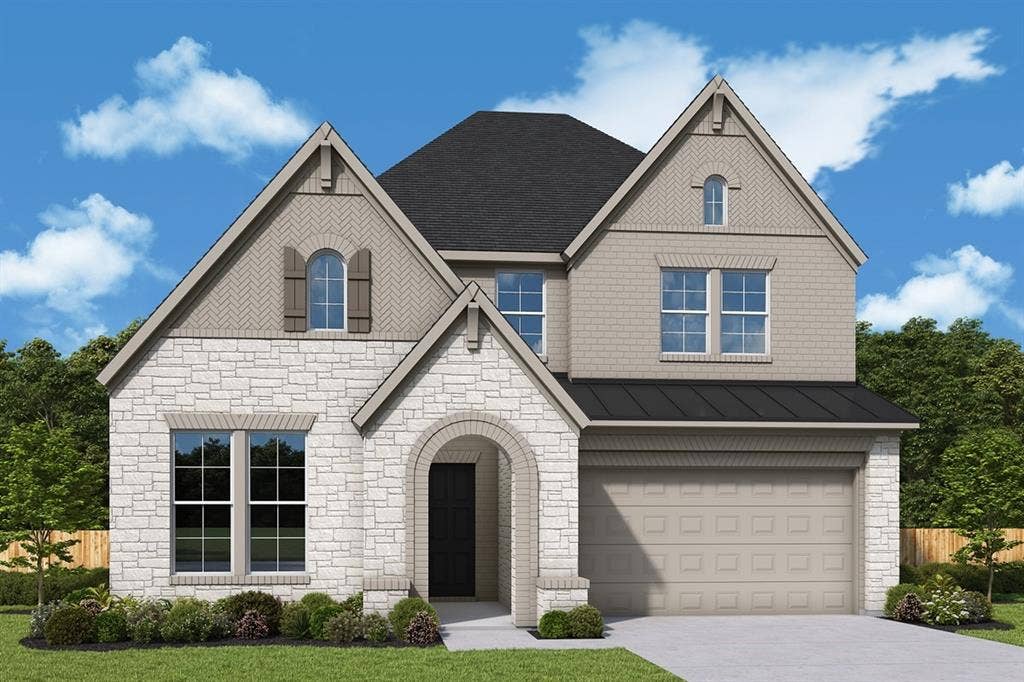 View of front of house with stone siding, concrete driveway, a garage, and a standing seam roof