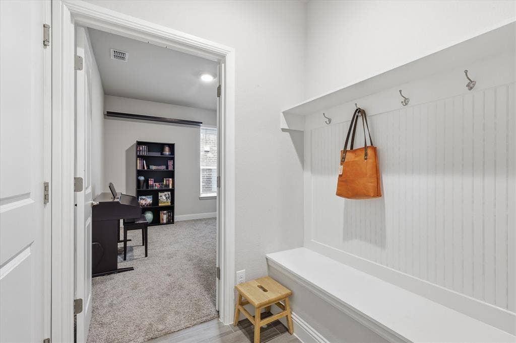 Great space to put on and off shoes or hang your bags when coming in from garage or front door
