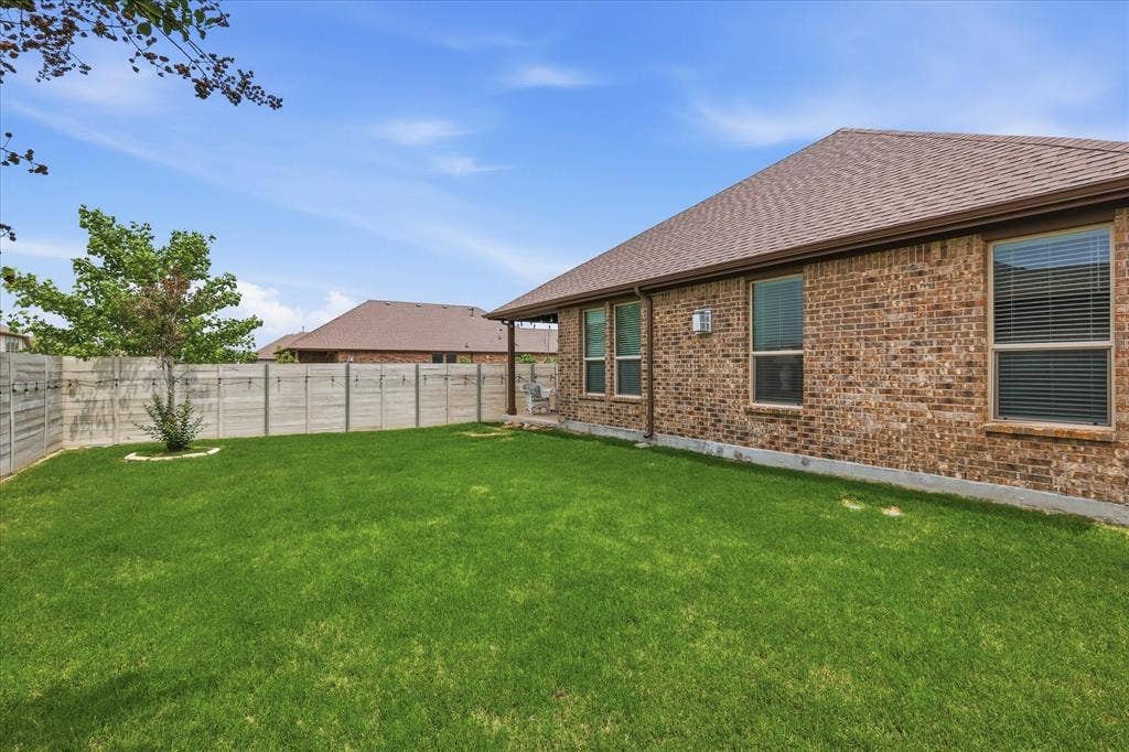 Lush green yard to enjoy with covered back patio area