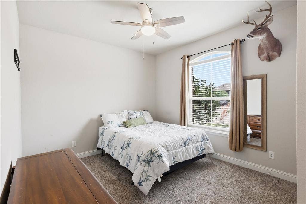 Bedroom 1 toward front of home has a great view of trees and foliage