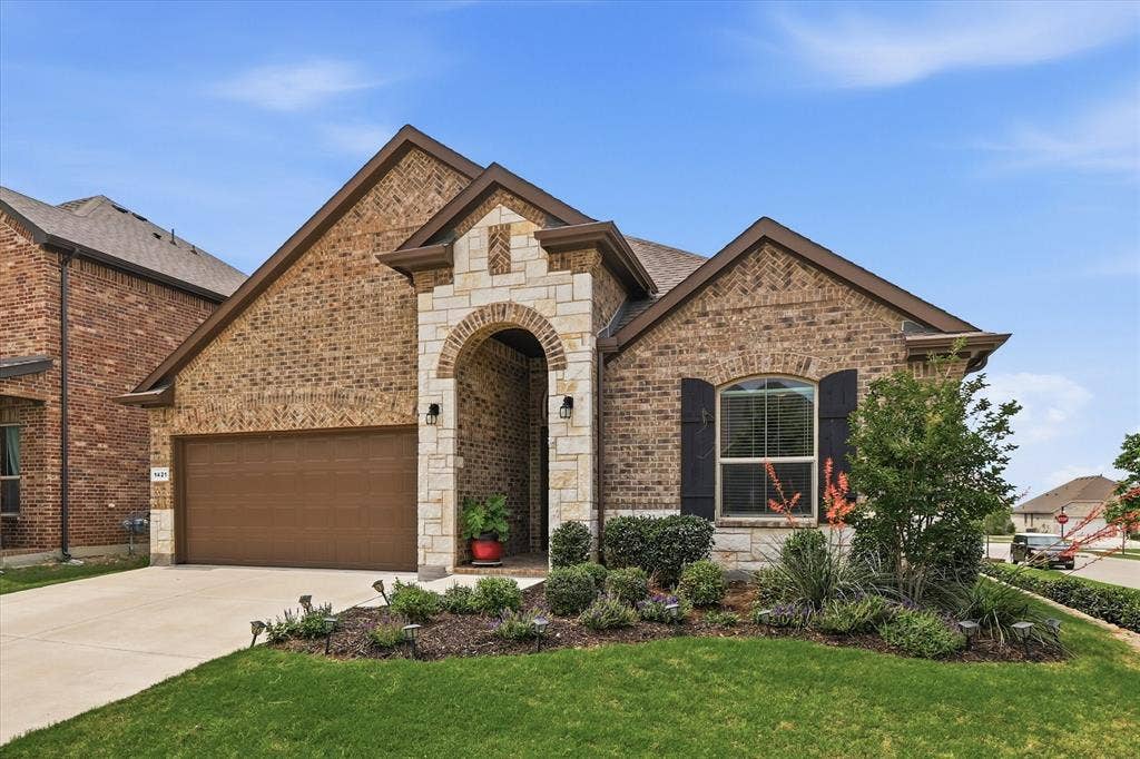 One owner brick and stone home in desirable neighborhood of Harvest - Argyle schools