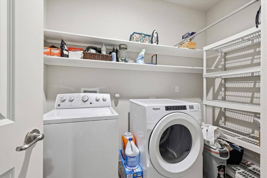 Laundry area with overhead storage and room for more