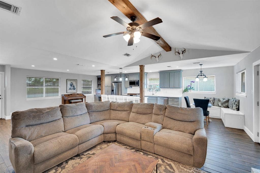 106 Hillcrest Drive, Midlothian, TX 76065 Large and spacious living area with ceiling fan, wood burning fireplace and natural light!