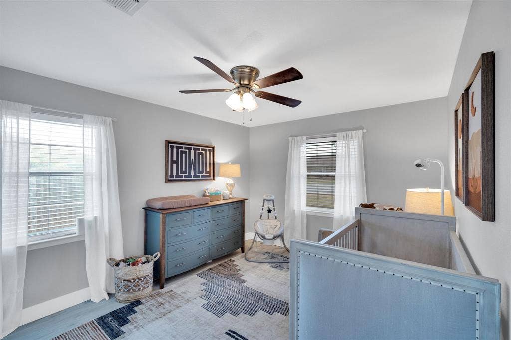 106 Hillcrest Drive, Midlothian, TX 76065 Bedroom featuring a nursery area and ceiling fan
