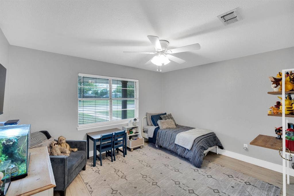 106 Hillcrest Drive, Midlothian, TX 76065 Bedroom featuring light wood-type flooring and natural light