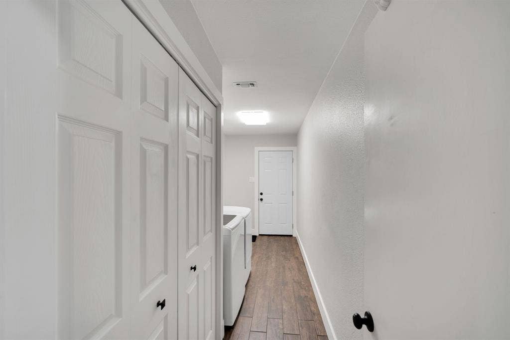 106 Hillcrest Drive, Midlothian, TX 76065 Massive laundry and utility space with built in cabinets, room for extra fridge or freezer and access to garage.