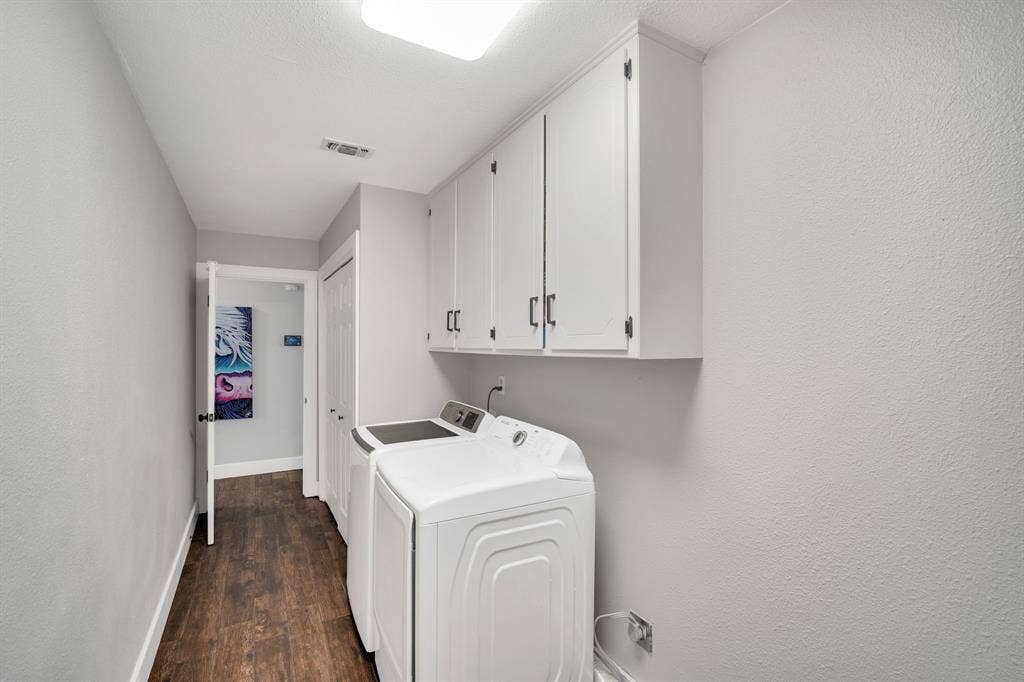 106 Hillcrest Drive, Midlothian, TX 76065 Massive laundry and utility space with built in cabinets, room for extra fridge or freezer and access to garage.