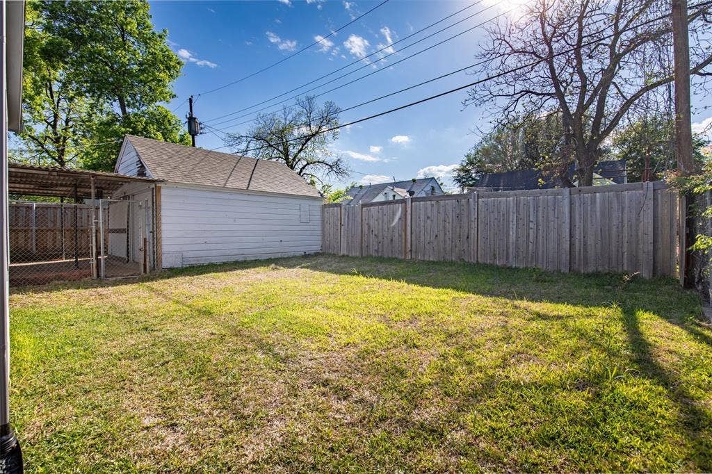Backyard and view of detached garage
