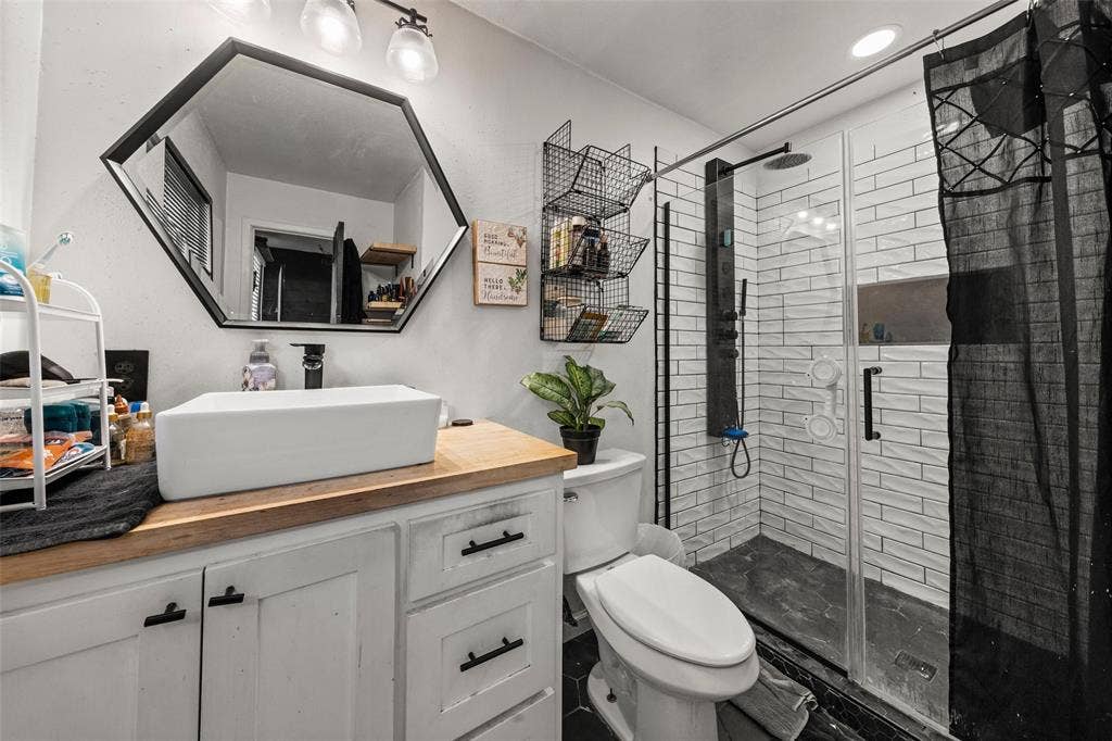 1207 Pembrook Drive, Waco, TX 76710 Full bathroom with vanity and a shower stall