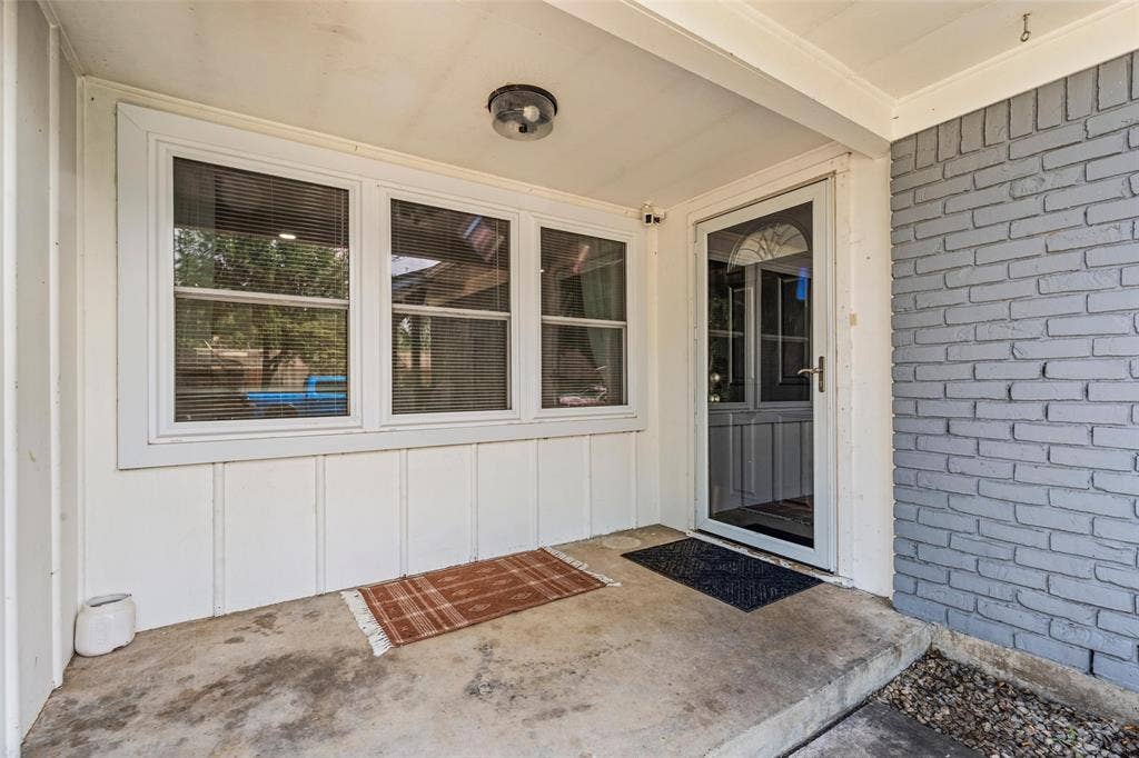 1207 Pembrook Drive, Waco, TX 76710 Entrance to property featuring brick siding, a patio area, and board and batten siding