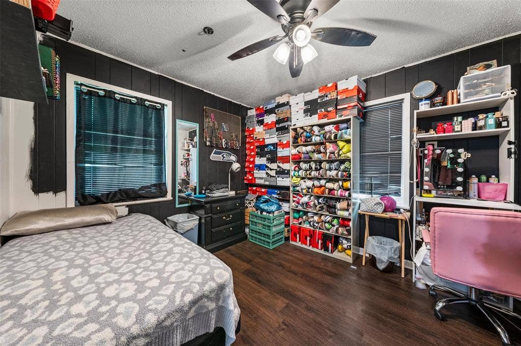1207 Pembrook Drive, Waco, TX 76710 Bedroom featuring a textured ceiling, dark wood-type flooring, and ceiling fan