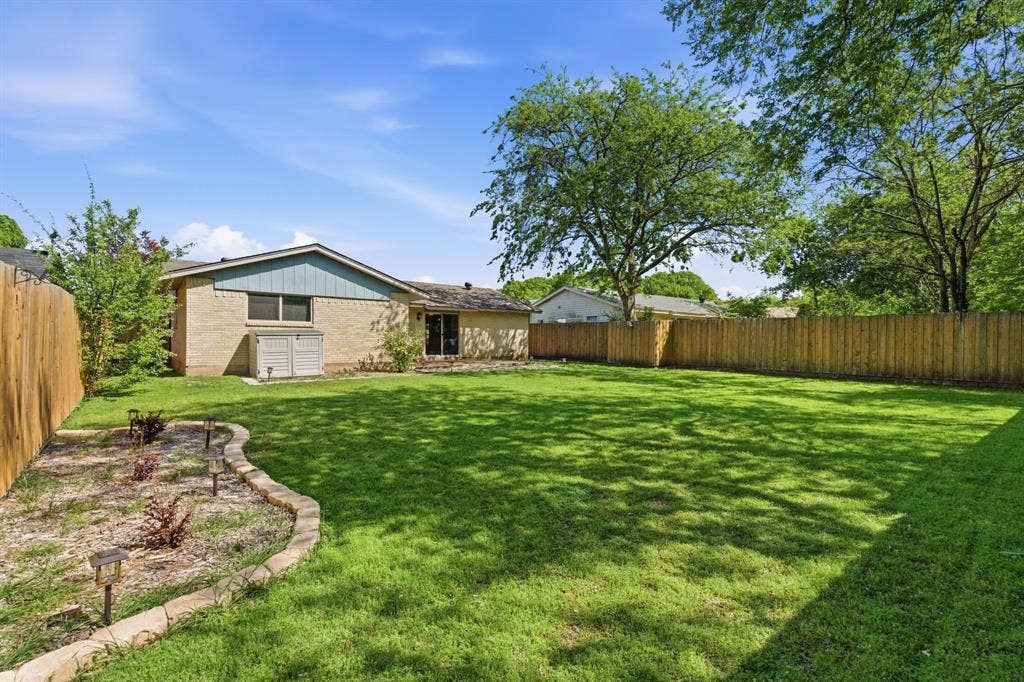 View of fenced backyard