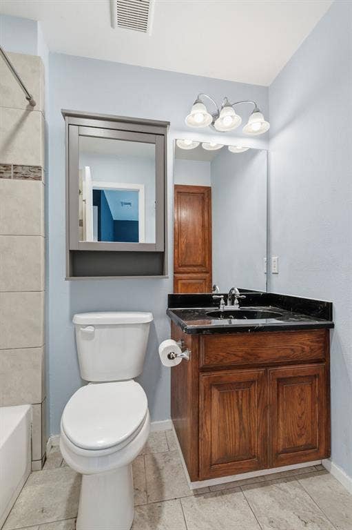 Full bathroom featuring vanity and shower / bath combination