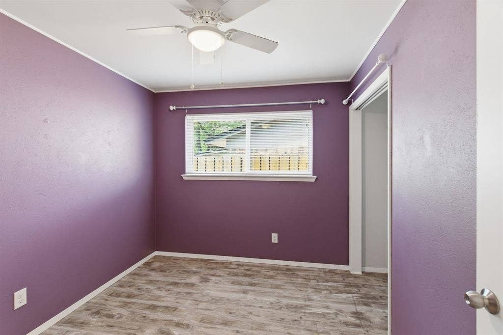 Unfurnished bedroom with light wood-style floors, ceiling fan, and a closet