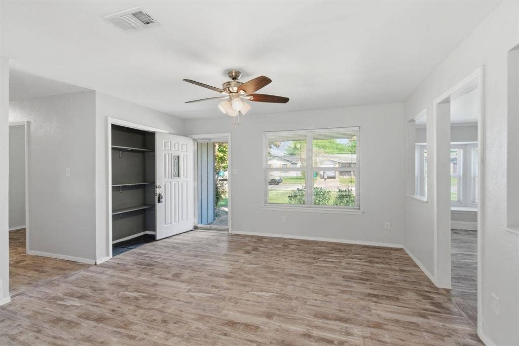Unfurnished bedroom featuring light wood-type flooring, a ceiling fan, and access to outside