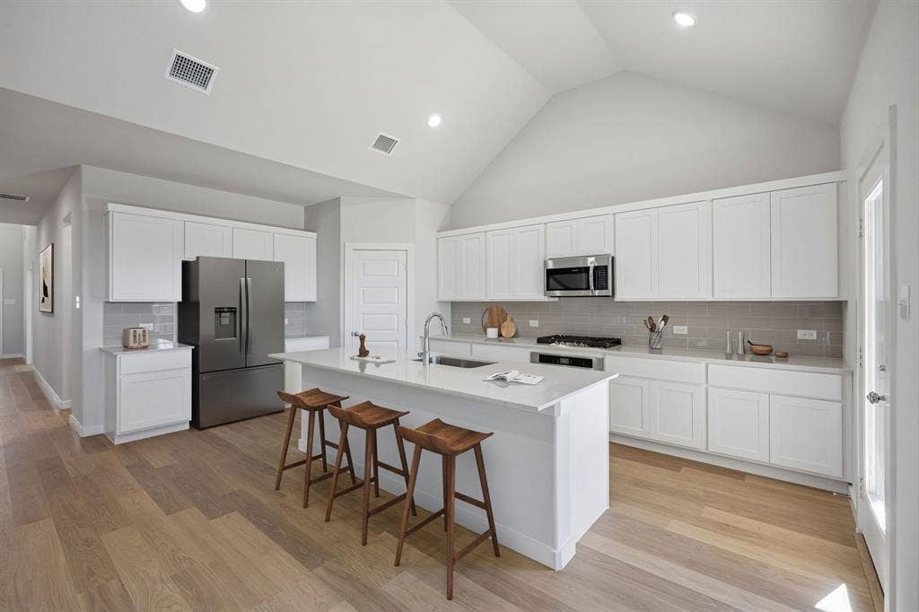 1461 Companero Street, Haslet, TX 76052 Kitchen in the Wimbledon home plan by Trophy Signature Homes – REPRESENTATIVE PHOTO